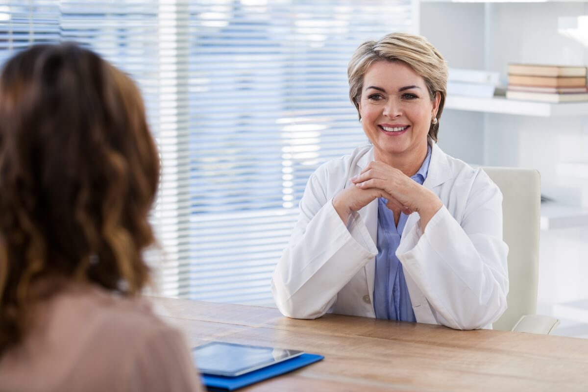 doctor talking her patient